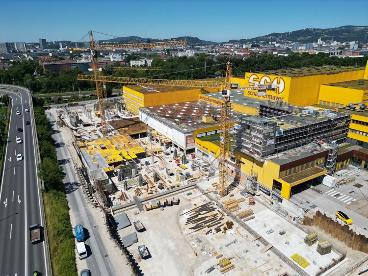 Construction site for an industrial hall on the outskirts of town, next to a main road